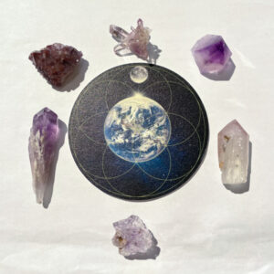 One world set with six amethyst crystals and earth crystal grid.